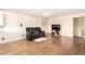 Cozy living room with wood floors, niches, and a comfortable seating area, perfect for relaxation at 4111 W Hayward Ave, Phoenix, AZ 85051