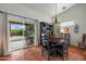 Bright dining room with terracotta floors and a view to the outside patio at 449 E Fred Ave, Apache Junction, AZ 85119