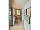 Hallway view of bedroom and bathroom with tiled floor and artwork at 4800 N 68Th St # 104, Scottsdale, AZ 85251