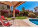 Inviting backyard with a covered patio, a lush garden, and comfortable seating, perfect for outdoor living at 4931 E Paradise Ln, Scottsdale, AZ 85254