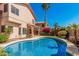 Beautiful backyard showcasing the pool, patio, and lush foliage, creating a private oasis at 4931 E Paradise Ln, Scottsdale, AZ 85254