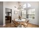 Cozy breakfast nook with white round table, modern chairs and lots of natural light at 4931 E Paradise Ln, Scottsdale, AZ 85254