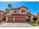 Charming two-story home with a spacious driveway, a two-car garage, and a well-maintained lawn at 4931 E Paradise Ln, Scottsdale, AZ 85254