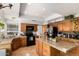 Spacious kitchen features wood cabinets, a central island, and modern appliances at 4931 E Paradise Ln, Scottsdale, AZ 85254