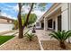 Beautiful backyard showcasing a tiled patio with artificial grass accents, mature trees, and comfortable outdoor living at 5127 N 71St St, Paradise Valley, AZ 85253