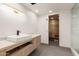 Modern bathroom features a vessel sink, contemporary fixtures, and a door to the sauna at 5127 N 71St St, Paradise Valley, AZ 85253