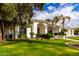 Attractive home exterior boasting lush green lawn, mature trees, and a charming facade at 5127 N 71St St, Paradise Valley, AZ 85253