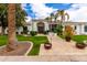 Beautiful home exterior with well-manicured lawn, mature trees, and an inviting front entrance at 5127 N 71St St, Paradise Valley, AZ 85253