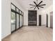 Bright living room with modern fireplace, ceiling fan and expansive sliding glass doors at 5127 N 71St St, Paradise Valley, AZ 85253