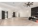 Spacious living room with modern fan, fireplace and hardwood floors ready for finishing touches at 5127 N 71St St, Paradise Valley, AZ 85253