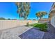 A backyard with green turf, rock landscaping, and a paved patio at 520 W Gibraltar Ln, Phoenix, AZ 85023