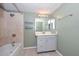 Bathroom featuring tile shower, tub, tiled floors, and single sink vanity at 520 W Gibraltar Ln, Phoenix, AZ 85023