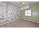 Charming bedroom featuring carpeted floors, neutral walls, and a wildlife-themed accent wall at 520 W Gibraltar Ln, Phoenix, AZ 85023