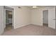 Bright bedroom showing a closet, connecting bathroom and large window that lets in plenty of light at 520 W Gibraltar Ln, Phoenix, AZ 85023