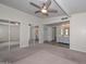 Expansive bedroom with plush carpet and bathroom access with a spacious closet at 520 W Gibraltar Ln, Phoenix, AZ 85023