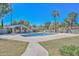 Relaxing community pool area with shaded seating and manicured landscaping at 520 W Gibraltar Ln, Phoenix, AZ 85023