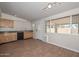 Eat-in kitchen featuring wood-look tile floors, wooden cabinets, and black appliances at 520 W Gibraltar Ln, Phoenix, AZ 85023