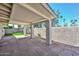 Covered patio with flagstone flooring offers a relaxing outdoor space at 520 W Gibraltar Ln, Phoenix, AZ 85023