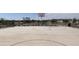 Outdoor basketball court with benches and landscaping in community common area on a sunny day at 5567 S 240Th Ln, Buckeye, AZ 85326