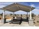 Covered picnic pavilion area with multiple picnic tables and manicured landscaping on a sunny day at 5567 S 240Th Ln, Buckeye, AZ 85326