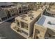 Aerial view of modern home showing desert landscaping and neighboring properties in a planned community at 6804 E Lyra Dr, Scottsdale, AZ 85257