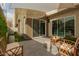 Modern backyard patio with sleek tile flooring, cozy seating, and sliding glass doors for seamless indoor-outdoor living at 6804 E Lyra Dr, Scottsdale, AZ 85257