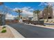 Community entrance with a decorative sign, desert landscaping, and modern architecture at 6804 E Lyra Dr, Scottsdale, AZ 85257