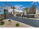 Community entrance with a decorative sign, desert landscaping, and modern architecture at 6804 E Lyra Dr, Scottsdale, AZ 85257