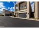 Contemporary home features clean lines, a dark garage door, and stylish outdoor accents in a modern neighborhood at 6804 E Lyra Dr, Scottsdale, AZ 85257