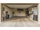 Spacious garage with ample storage space, overhead racks, and built in work bench at 6804 E Lyra Dr, Scottsdale, AZ 85257