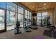 Bright community gym featuring modern exercise equipment and large windows with a pool view at 6804 E Lyra Dr, Scottsdale, AZ 85257