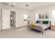 Bright main bedroom with neutral carpet, recessed lighting, and coordinating furniture at 6804 E Lyra Dr, Scottsdale, AZ 85257