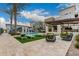 Inviting community pool area with lounge chairs, modern furniture, and well-maintained landscaping at 6804 E Lyra Dr, Scottsdale, AZ 85257