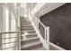 Bright staircase with white railings, carpeted steps, and a feature wall for a contemporary design at 6804 E Lyra Dr, Scottsdale, AZ 85257