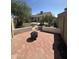 Cozy brick patio with fire pit in a private backyard with mature trees at 7410 W Eva St, Peoria, AZ 85345