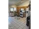 Sunlit kitchen features wooden cabinets, white appliances, and tile flooring at 7410 W Eva St, Peoria, AZ 85345