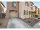 Two-story home with an attached one-car garage and concrete driveway at 7741 W Giles Rd, Phoenix, AZ 85035