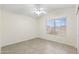 This bedroom is tiled, has a window with bars, and includes a ceiling fan with lights at 7910 W Adobe Dr, Glendale, AZ 85308