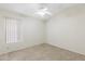 Neutral bedroom featuring neutral tile floors and fan at 7910 W Adobe Dr, Glendale, AZ 85308