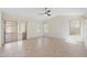 A bright living room featuring tile flooring, and access to the patio at 7910 W Adobe Dr, Glendale, AZ 85308