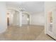 Spacious living area featuring tile flooring and arched doorways at 7910 W Adobe Dr, Glendale, AZ 85308