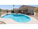 Gorgeous backyard pool and jacuzzi offer a relaxing outdoor space with covered patio at 7910 W Adobe Dr, Glendale, AZ 85308