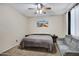 Bright bedroom with neutral walls, a ceiling fan, and a relaxing atmosphere at 8005 S 69Th Ln, Laveen, AZ 85339