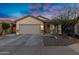 Charming single-story home with a neutral color scheme, well-kept landscaping and a two car garage at 8005 S 69Th Ln, Laveen, AZ 85339