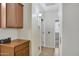 Hallway featuring overhead lighting and stylish cabinetry at 8005 S 69Th Ln, Laveen, AZ 85339