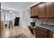 Modern kitchen with a Keurig, granite countertops, and decorative tile backsplash at 8005 S 69Th Ln, Laveen, AZ 85339