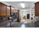 Well-designed kitchen featuring granite countertops, stainless steel appliances, and ample cabinet storage at 8005 S 69Th Ln, Laveen, AZ 85339