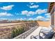 Spacious balcony with wrought iron railing and seating, offering scenic neighborhood views at 8432 S 21St Pl, Phoenix, AZ 85042