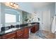 Bathroom featuring granite counters with dual sinks, and an expansive mirror above at 8432 S 21St Pl, Phoenix, AZ 85042