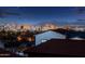 Night view shows lit city skyline with a mountain view from the home's rooftop at 8432 S 21St Pl, Phoenix, AZ 85042